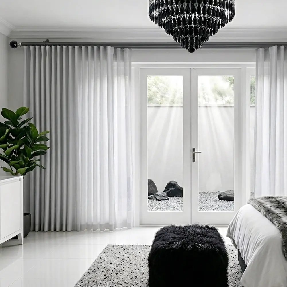 Gun metal 28mm double pole set with a decorative faceted crystal finial and matching hardware, shown in a modern interior.