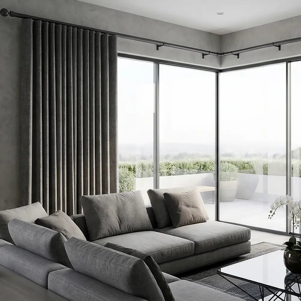 A 28mm double curtain pole set in matt black, showcasing a traditional ball finial on the primary rod and a minimalist end cap on the secondary rod, set against an interior backdrop.