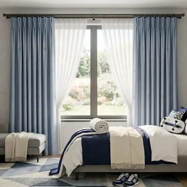 Gun metal 28mm double pole set with streamlined end caps, shown in a modern interior setting.